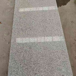 南充芝麻白光面毛板